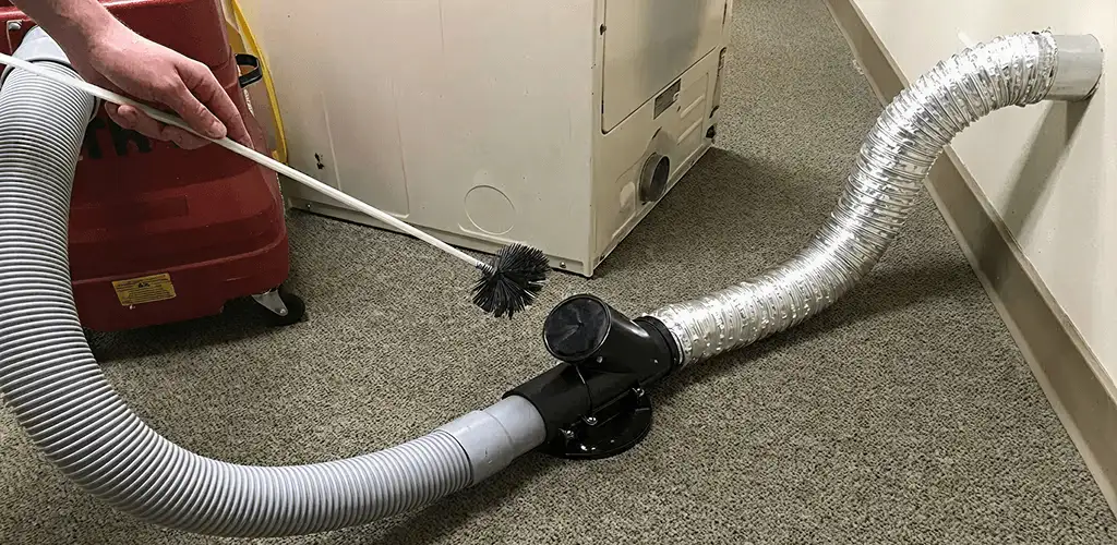 Dryer vent cleaning service removing lint from a dryer duct connection in Norfolk, VA