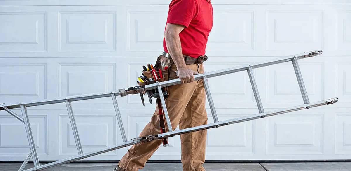 Garage door repair technician arriving with tools and ladder in Norfolk, VA