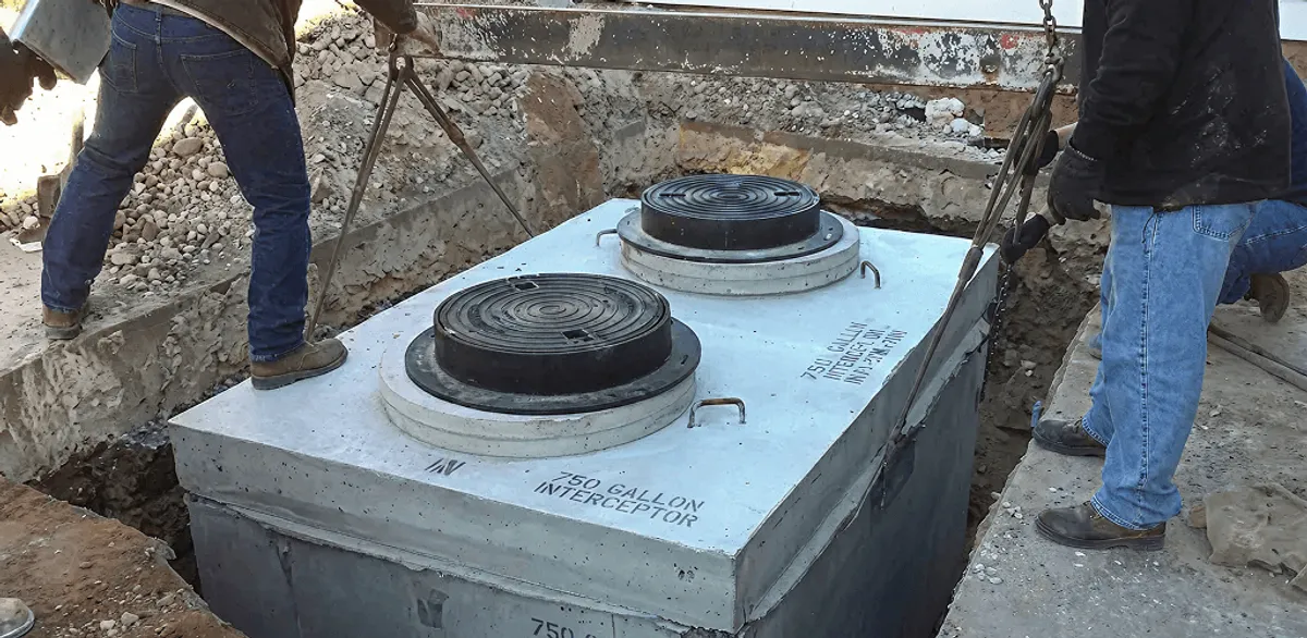 Grease trap installation for a commercial property drainage system in Norfolk, VA