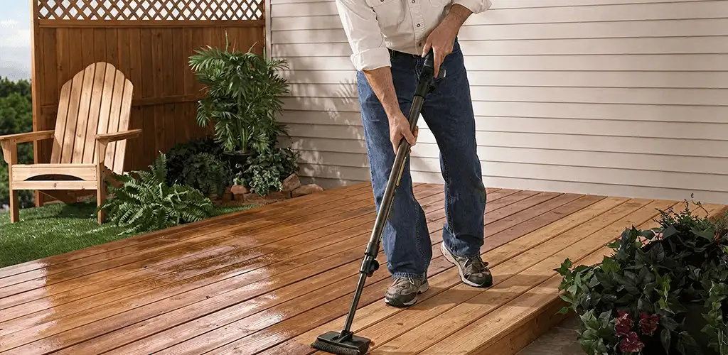 Deck staining service applying stain to a backyard wood deck in Norfolk, VA
